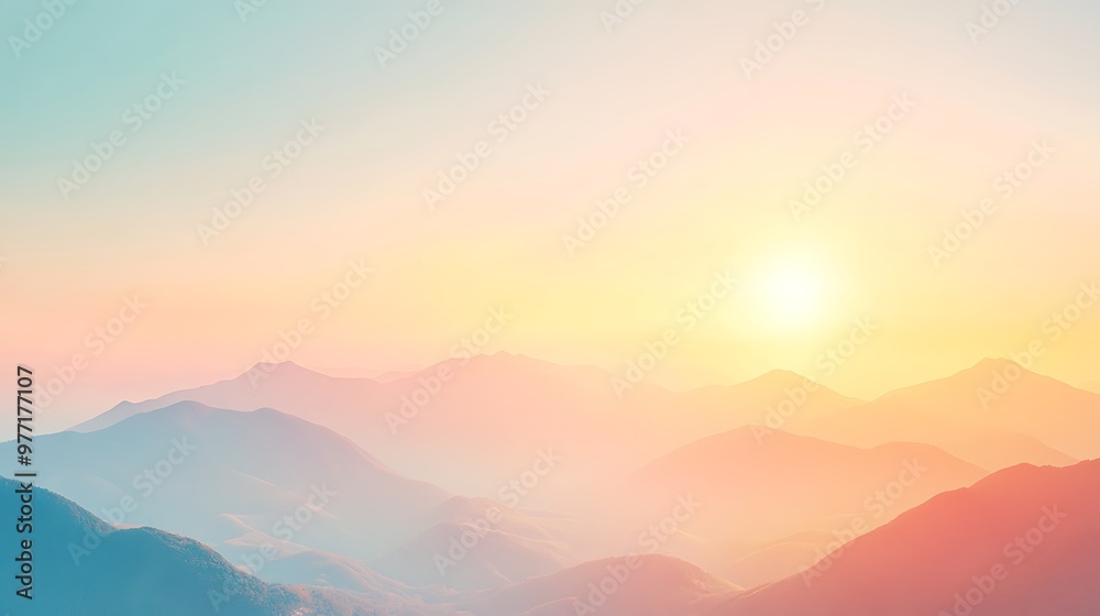 Obraz premium A soft, glowing sunset behind mountains with a clear sky for text