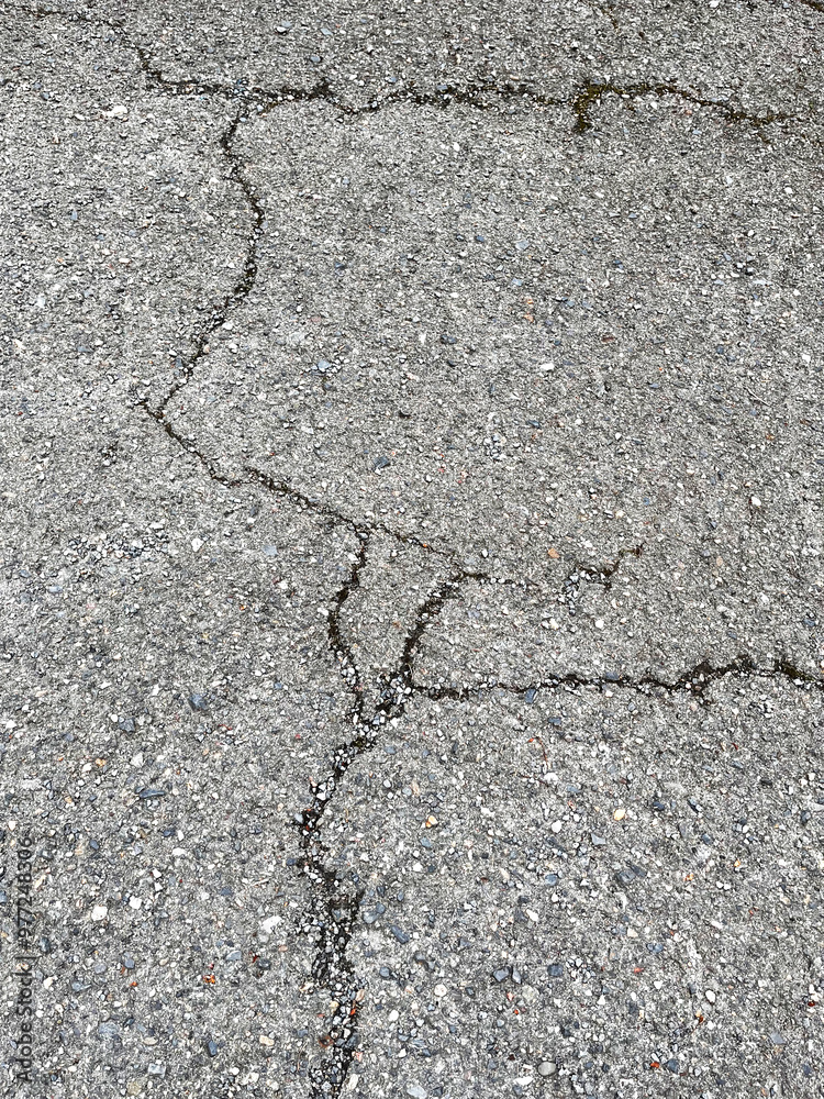 Obraz premium asphalt cracks, pavement destruction, patched asphalt texture of white paint for road marking on asphalt, texture of painted asphalt cracked texture white background, white background on gray wall
