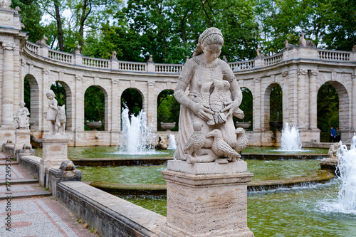 Scene at the historic fairytale fountain with figures from the Grimm Brothers' stories in Berlin-Friedrichshain. photo