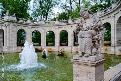Scene at the historic fairytale fountain with a figure from the Grimm Brothers' stories in Berlin-Friedrichshain. photo