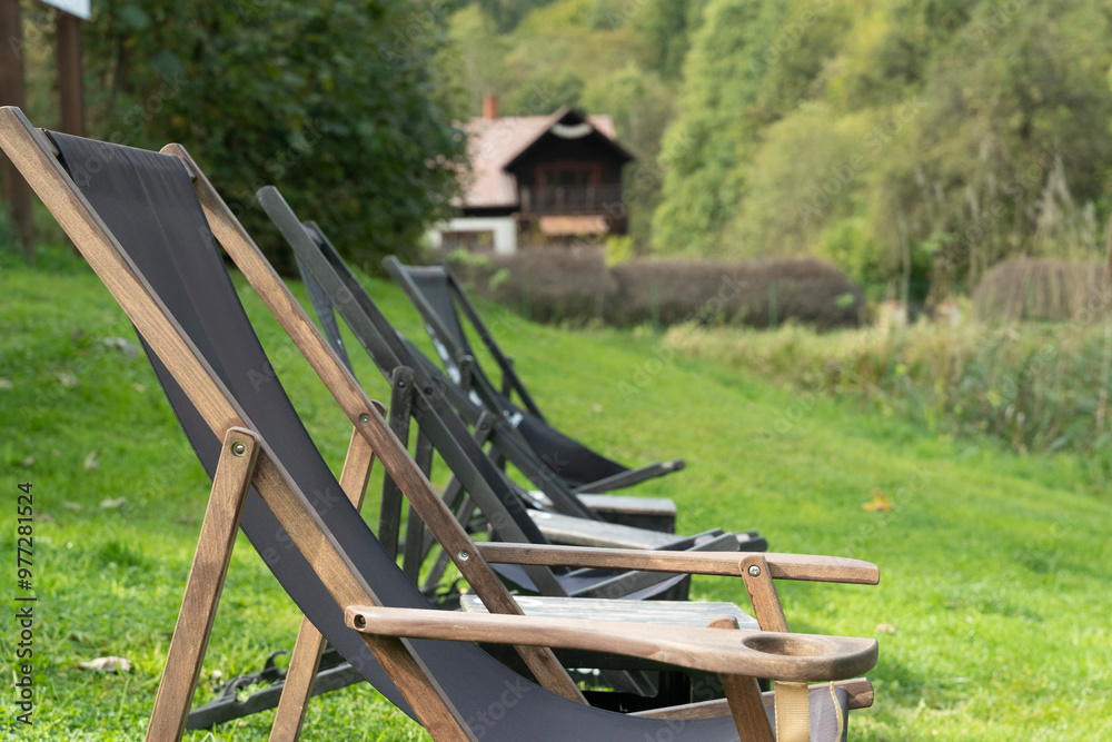 deckchair spread out on the grass on a sunny summer day