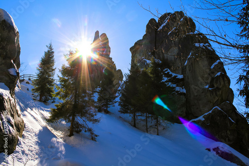 Ukrainian medieval cliff-side Tustan fortress ruins on snow in winter photo