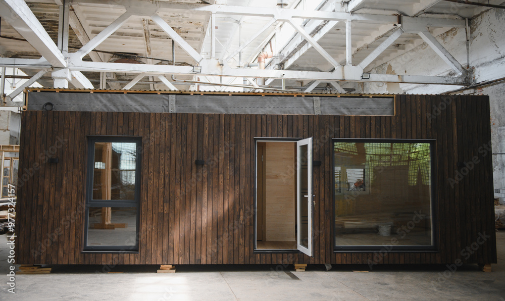 A new wooden modular prefabricated house inside in manufacturing facility A new wooden modular prefabricated house inside in manufacturing facility