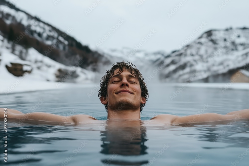 An individual relaxes in a hot spring with arms outstretched, surrounded by snow-covered mountains and mist, showcasing the allure of natural open-air baths in a cold climate. An individual relaxes in a hot spring with arms outstretched, surrounded by snow-covered mountains and mist, showcasing the allure of natural open-air baths in a cold climate.