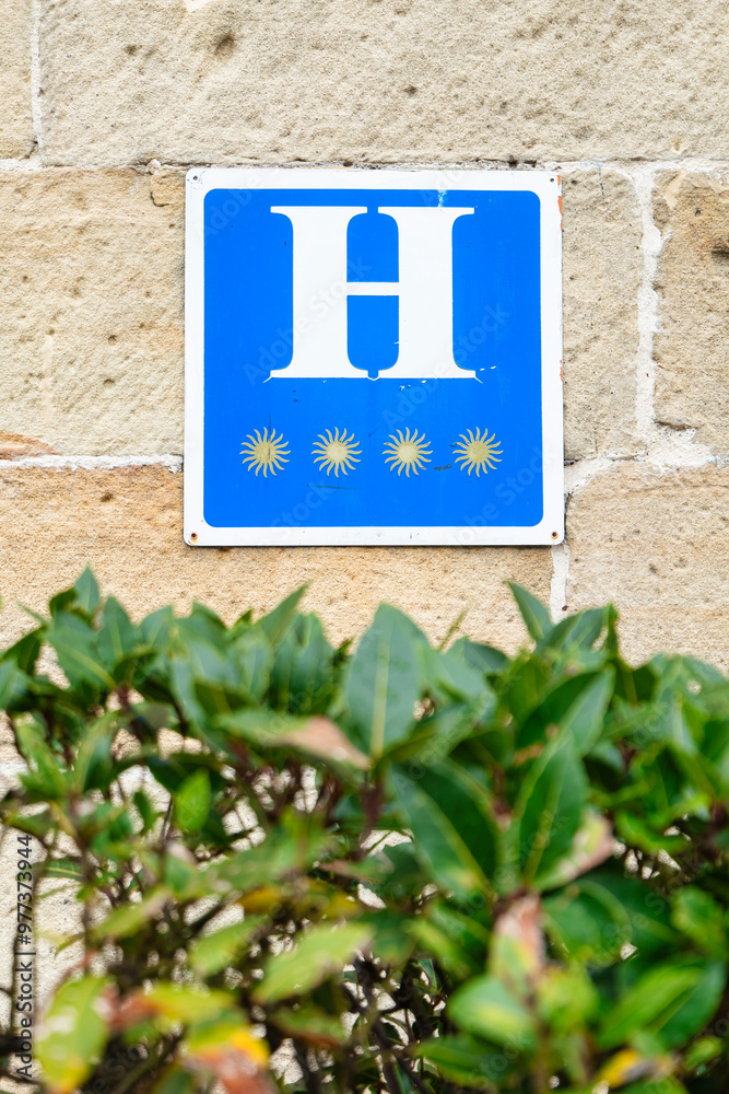 Sign of a four-star hotel, metal plaque Sign of a four-star hotel, metal plaque