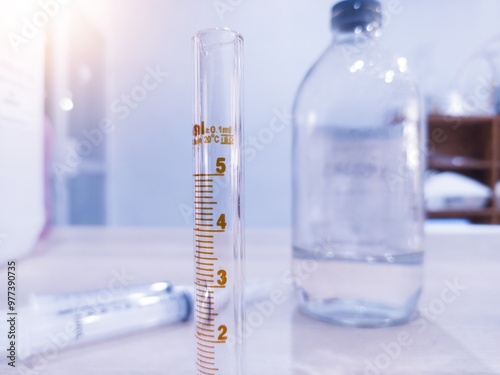 Close up the Borosilicate glass measuring  to measure doses for laboratory purposes. photo