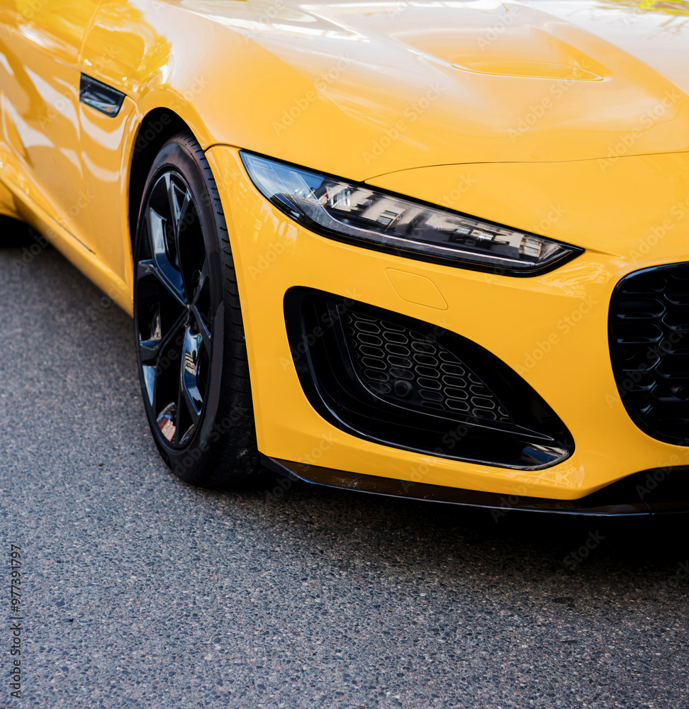 Fototapeta premium headlight of luxury yellow sportscar.