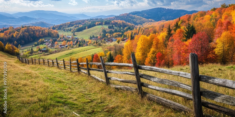 A rustic wooden fence along a vibrant autumn landscape in the Carpathian Mountains A rustic wooden fence along a vibrant autumn landscape in the Carpathian Mountains