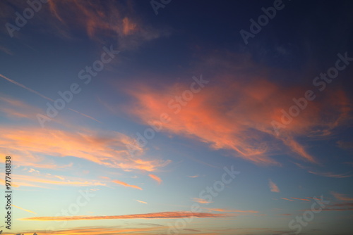 Blurry background of red sunset sky. Dramatic sky with colorful cloud background. Red burning sunset sky. Copy space.