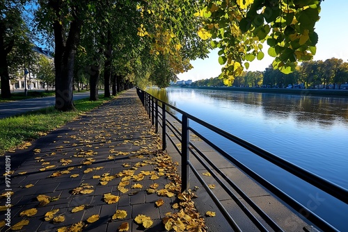 A quiet morning walk along the Long Embankment (DÅ‚ugie PobrzeÅ¼e), with the MotÅ‚awa River gently flowing by photo