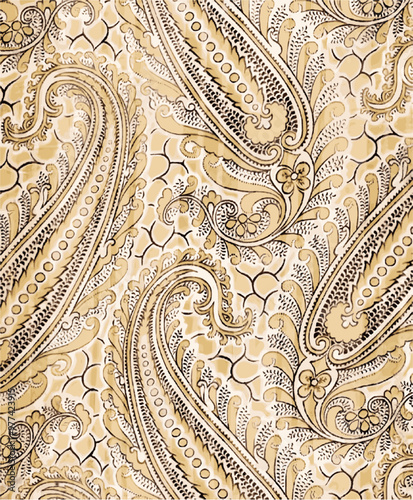 Paisley pattern in beige and brown on a yellow background, evoking vintage elegance and textile design.