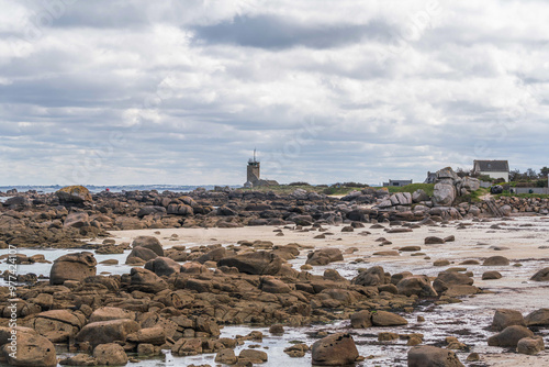 Natural landscape of the rocky beach and seascape along the Brittany coastline, Côte de granite rose or Pink Granite Coast in France photo