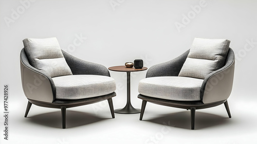 Modern armchairs and a small table create a stylish seating area, perfect for cozy conversations or elegant interiors.