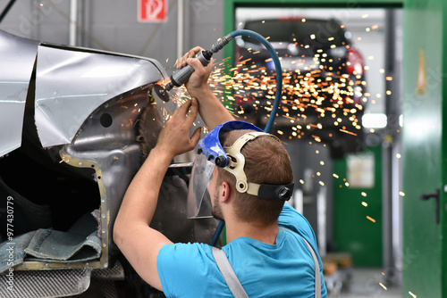 фотографія repair car body by a mechanics in the workshop