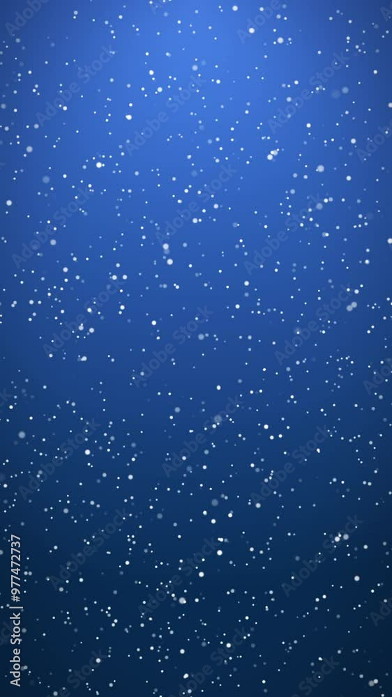 Vertical video animation of falling snow on blue background - seamless loop - Christmas and vacation concept.