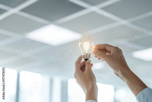 Lighting concept using LEDs and compact-fluorescent (CFL) bulbs. Asia man changing bulbs.