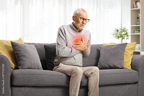 Elderly man with cardiac arrest sitting on a sofa