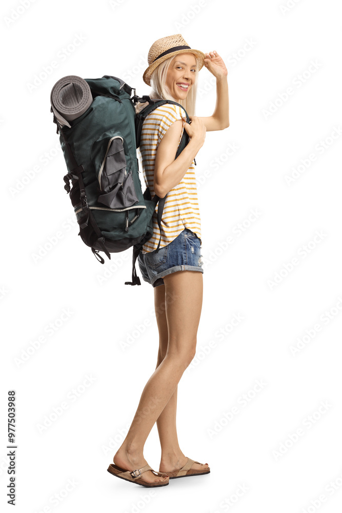 Female tourist carrying a backpack and greeting with hat Female tourist carrying a backpack and greeting with hat