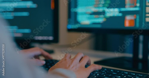 Closeup young adult Asia female freelance typing write prompt AI bot IT app program nomad, video game, terminal with coding language, designer, big data center on desktop computer in night office.