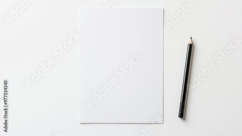 A blank white paper sheet laying flat on a clean white desk, ready for note-taking or design purposes. The simplicity of the scene highlights the paper's versatility.