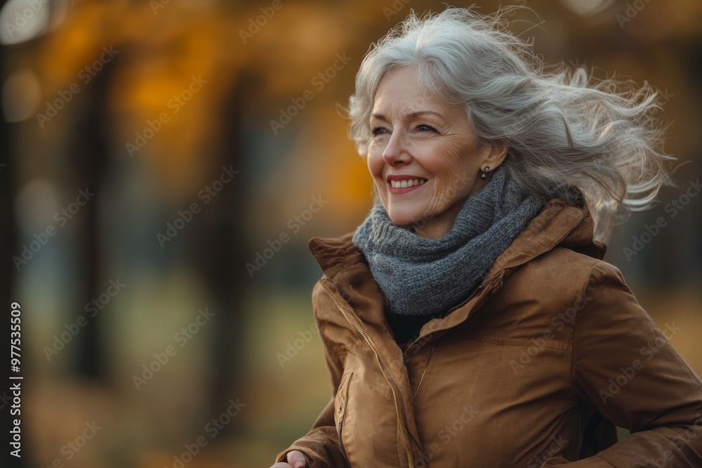 Portrait of happy senior woman running in autumn park. Healthy lifestyle Portrait of happy senior woman running in autumn park. Healthy lifestyle