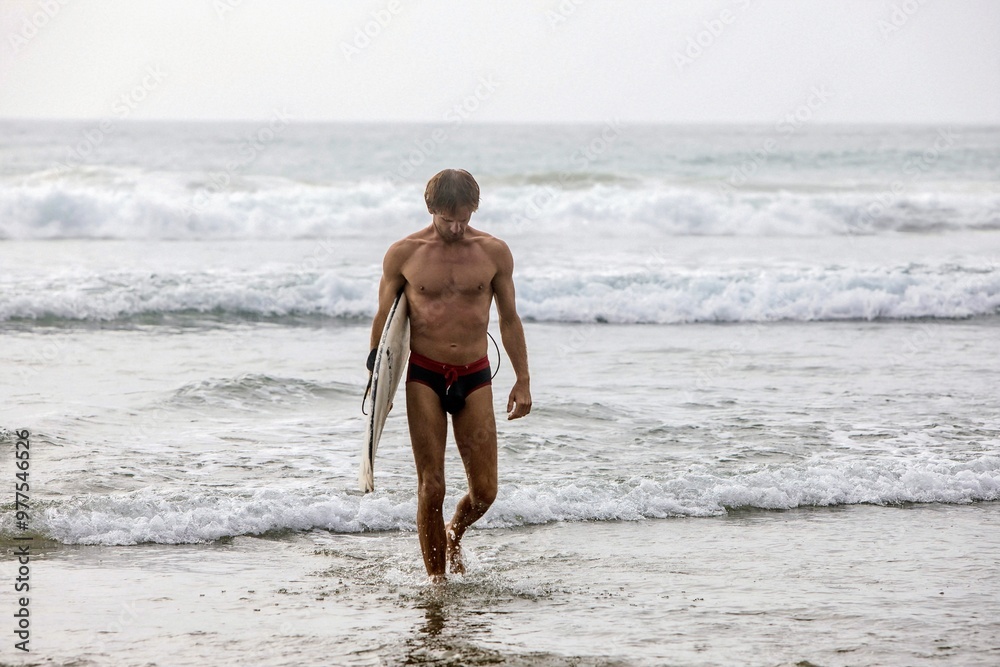 Fototapeta premium man walking on the beach