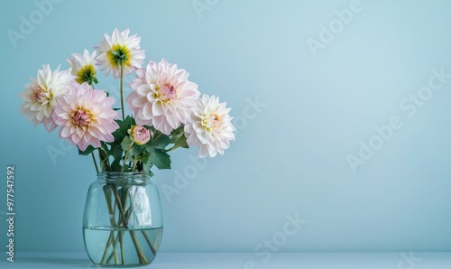 It's a gorgeous blue vase filled with delicate pink and white blooms.