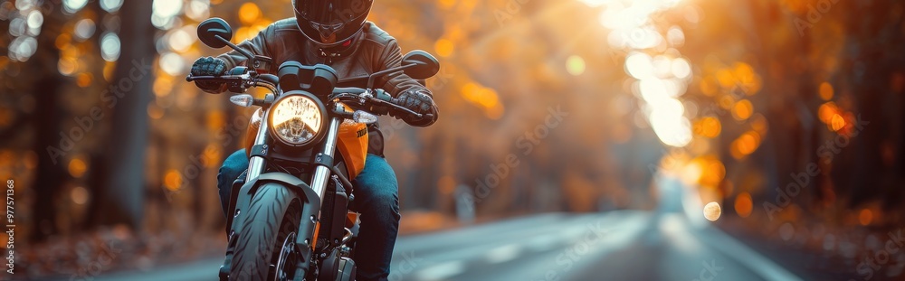 a biker using phone as navigation while on the road a biker using phone as navigation while on the road
