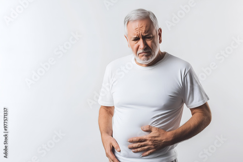 American elder man suffering from abdominal discomfort.