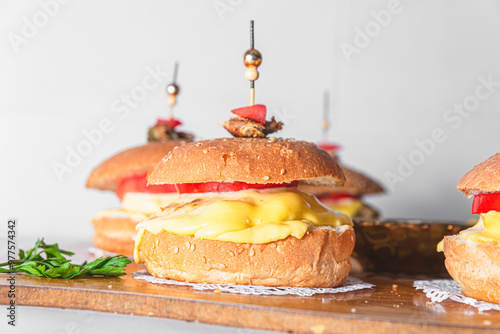 Close-up of burger on table against white background