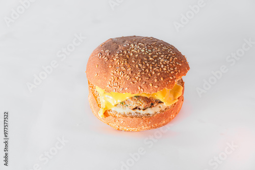 Close-up of burger on table against white background