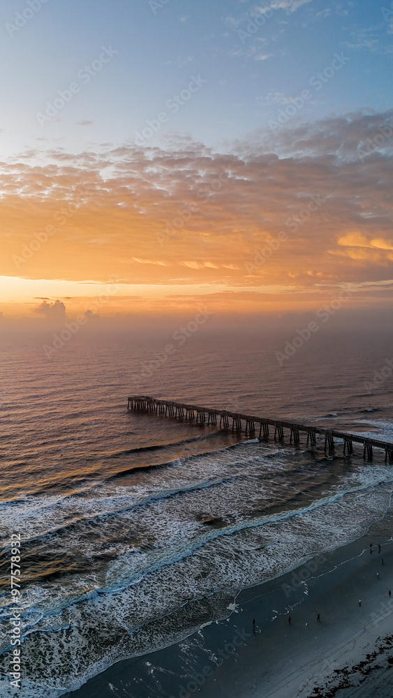 Aerial view of sunrise at Jacksonville Beach pier in Jacksonville Beach Florida USA Aerial view of sunrise at Jacksonville Beach pier in Jacksonville Beach Florida USA