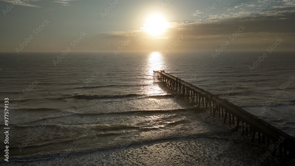Aerial view of sunrise at Jacksonville Beach pier in Jacksonville Beach Florida USA Aerial view of sunrise at Jacksonville Beach pier in Jacksonville Beach Florida USA