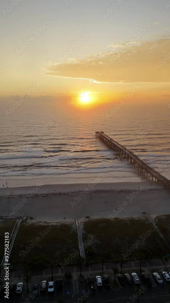 Aerial view of sunrise at Jacksonville Beach pier in Jacksonville Beach Florida USA Aerial view of sunrise at Jacksonville Beach pier in Jacksonville Beach Florida USA