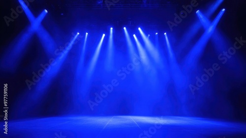 Bright blue stage lights beaming down on an empty surface creating dramatic contrast and vibrant illumination perfect for performances