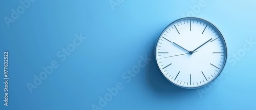 Wallpaper Mural Minimalist wall clock on a blue background, highlighting the concept of time in a modern and stylish design. Torontodigital.ca