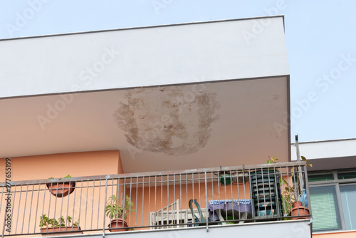 Ceiling damage in a residential building due to water infiltration, underscoring the necessity for renovation