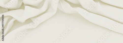 Delicate white fabric with soft folds. 