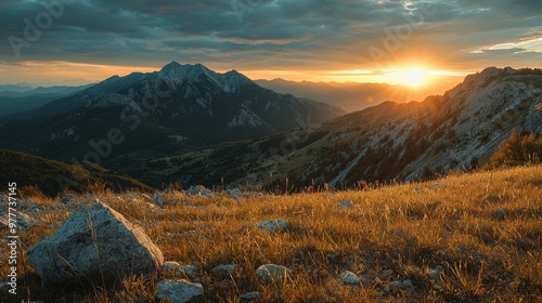 A photo of a mountain landscape during sunset