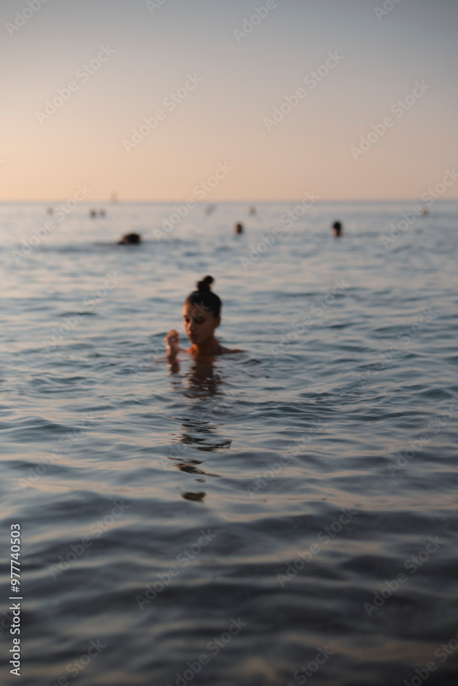 Experience the Serene Evening Swim in the Calm Waters of a Beautiful Tropical Ocean Experience the Serene Evening Swim in the Calm Waters of a Beautiful Tropical Ocean