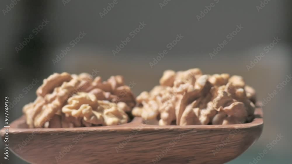 Walnut Kernels in a Wooden Plate Walnut Kernels in a Wooden Plate