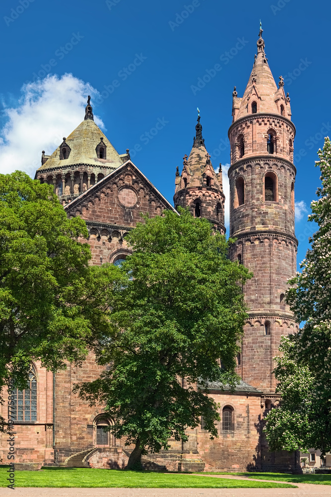 Worms, Germany. Fragment of St. Peter's Cathedral (Worms Cathedral) with central tower on the crossing and two eastern choir towers. The cathedral was built from about 1130 to 1181. Worms, Germany. Fragment of St. Peter's Cathedral (Worms Cathedral) with central tower on the crossing and two eastern choir towers. The cathedral was built from about 1130 to 1181.