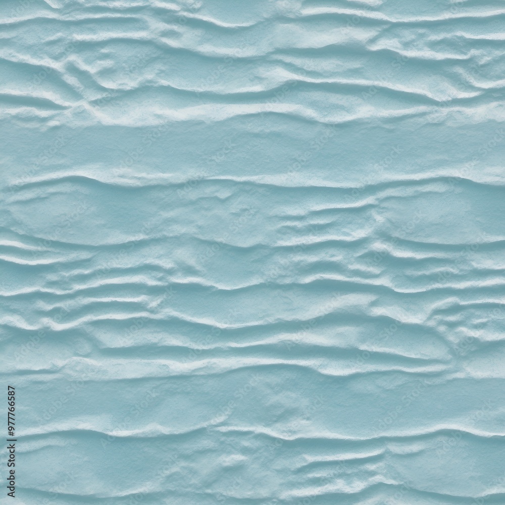 Fototapeta premium Close-up view of a textured surface with a consistent pattern. The surface appears to be a light blue color, with a slightly rough and uneven texture that resembles ripples or waves.