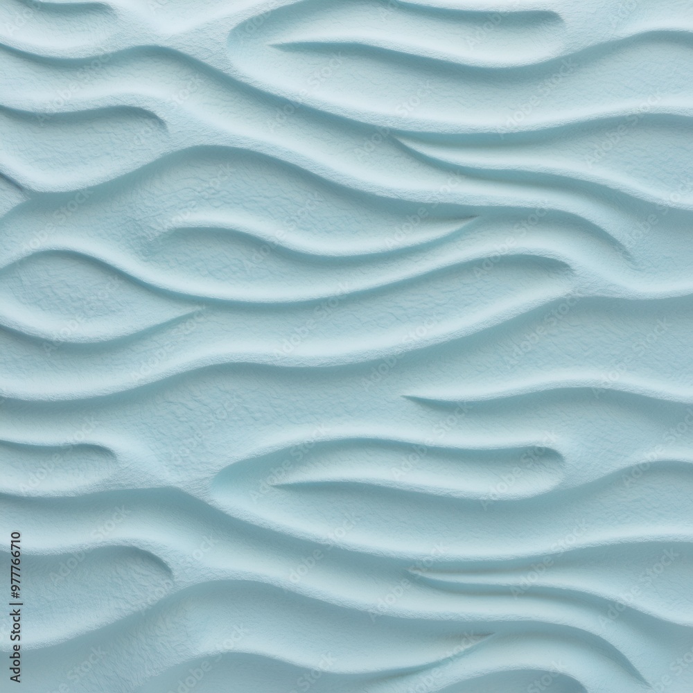 Fototapeta premium Close-up view of a textured surface with a consistent pattern. The surface appears to be a light blue color, with a slightly rough and uneven texture that resembles ripples or waves.