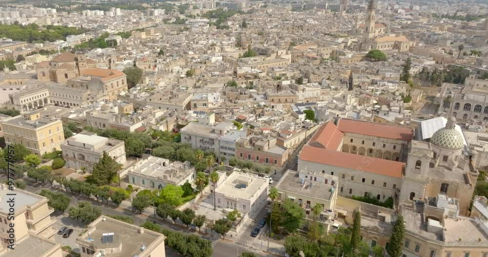 Panoramic aerial view of the southern part of the historic center of Lecce, Puglia, Italy. In the foreground are the Church of Carmine and the Basilica of San Giovanni Battista al Rosario. Panoramic aerial view of the southern part of the historic center of Lecce, Puglia, Italy. In the foreground are the Church of Carmine and the Basilica of San Giovanni Battista al Rosario.