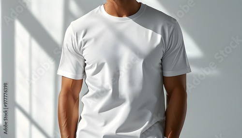 Professional mockup of a white t-shirt featuring subtle shadows and lighting to accentuate texture, ideal for showcasing design work photo