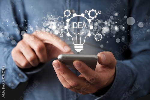 Man Using Smartphone With Lightbulb Idea Concept