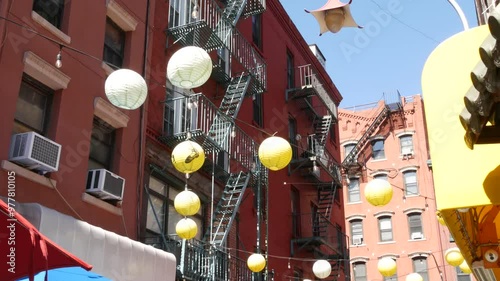 New York City, United States. Manhattan Chinatown Doyers street, chinese ethnic district building architecture, USA. Brick houses, round paper lanterns, little China town. American fire escape ladder.
