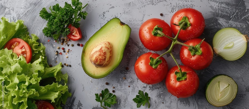 Lettuce tomato parsley avocado and onion on a gray backdrop The idea of vegetarian cuisine a healthy lifestyle and nutrition Copy space Lettuce tomato parsley avocado and onion on a gray backdrop The idea of vegetarian cuisine a healthy lifestyle and nutrition Copy space