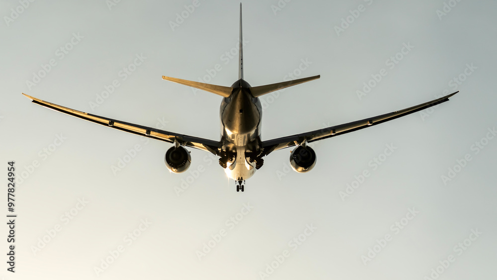 passenger airliner in the sky at sunset passenger airliner in the sky at sunset